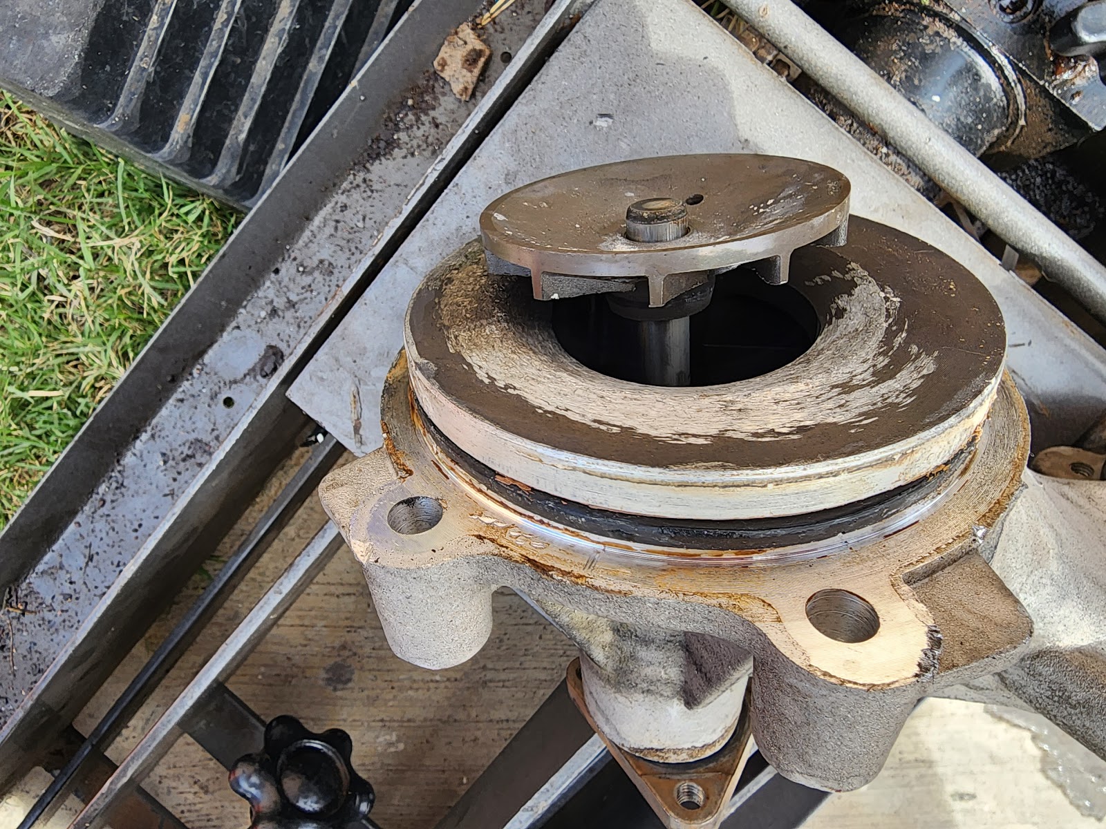 Removed water pump on the tailgate, impeller worn and streaked